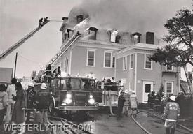 Box 3111-October 13, 1985-A view of the rear as Westerly and Pawcatuck's ladder trucks go to work on the fire.
