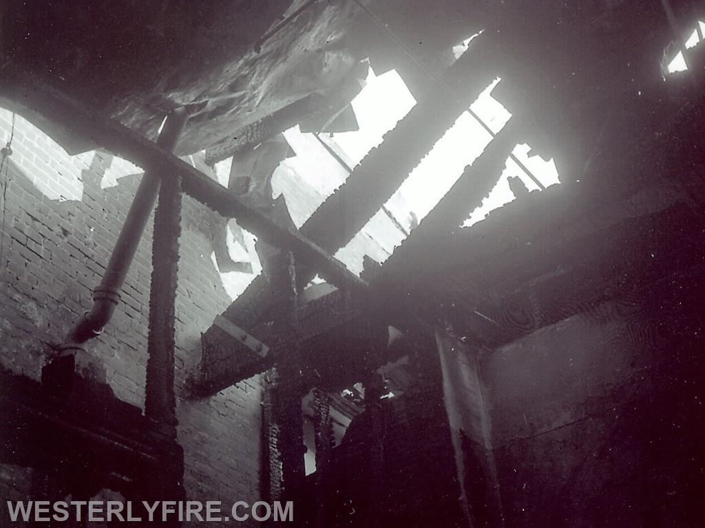 Box 1122-January 8, 1963-View of the severe damage done to the roof members which would necessitate removal of the third floor.