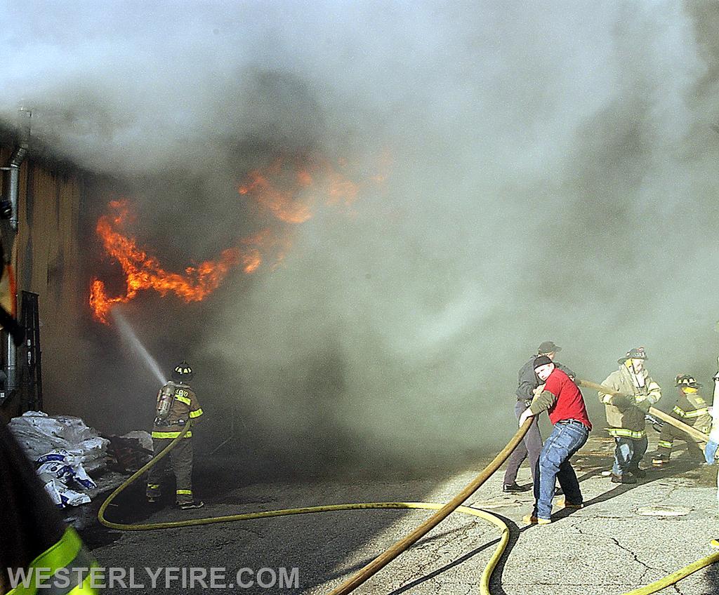 Box 1313-February 4, 2004-Westerly firefighters attacking the fire with multiple hose lines assisted by workers. 