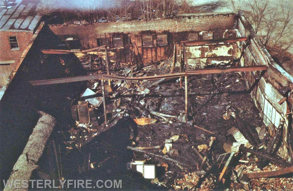 Box 3111-March 14, 1975-A view from atop Westerly Ladder 1 shows the nature of the destruction. Note the twisted, warped steel.