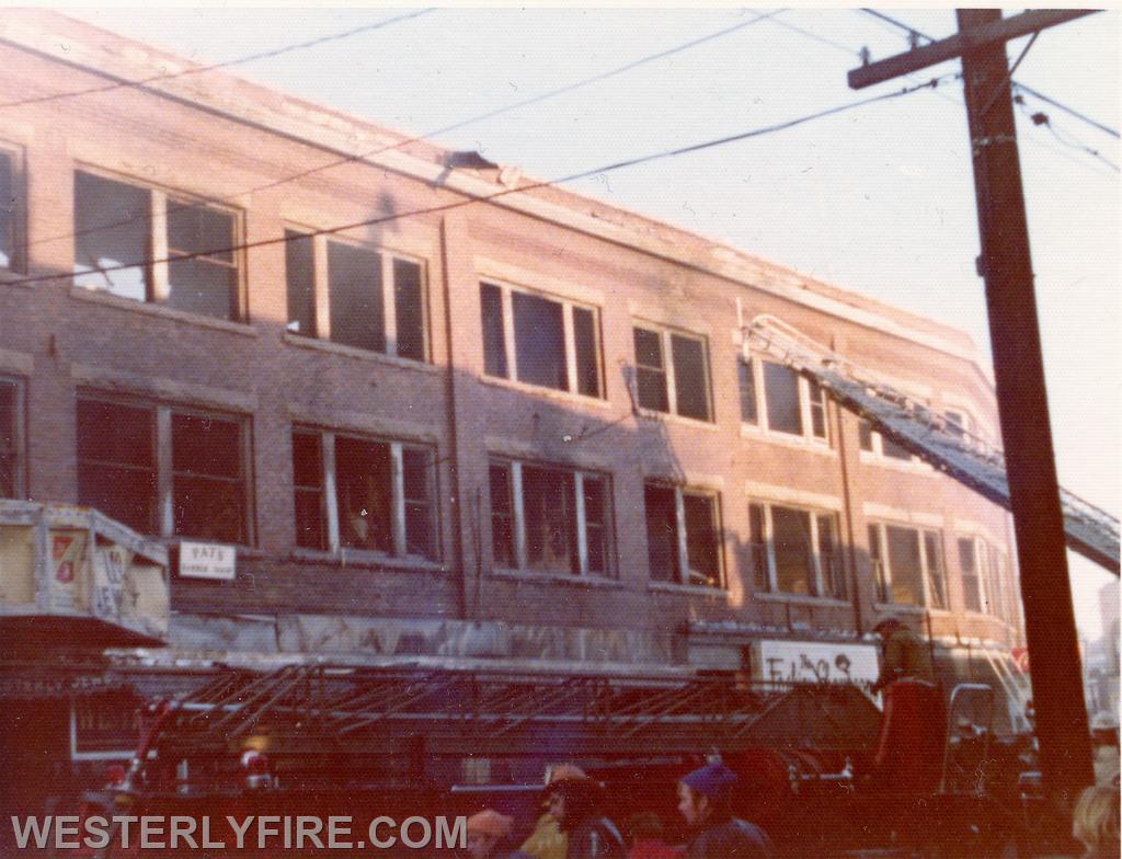 Box 3111-March 14, 1975-Pawcatuck firefighters secure the aerial ladder while Westerly's is still operating.