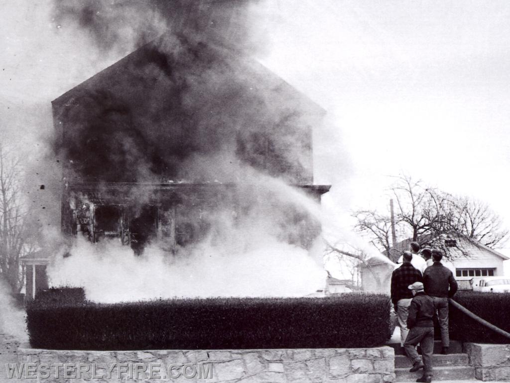 Box 1253-4/6/1964. Westerly firemen begin the attack with a 2 1/2 inch hose line at 144 Granite St.