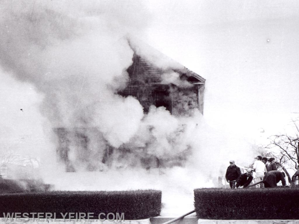 Box 1253-4/6/1964-Fire turns to steam as water is applied by firemen at 144 Granite St.
