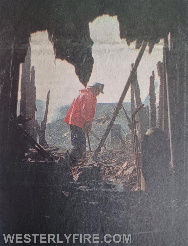 Box 1328-8-9-1998-Westerly Airport-An investigator from the State Fire Marshal's office sifts through debris.

