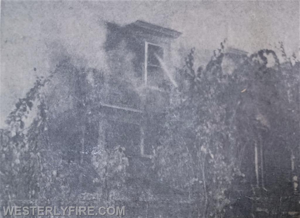 Box 3153-October 30,1962-Firefighters train a hose stream into the second floor window at 38 Highland Ave.