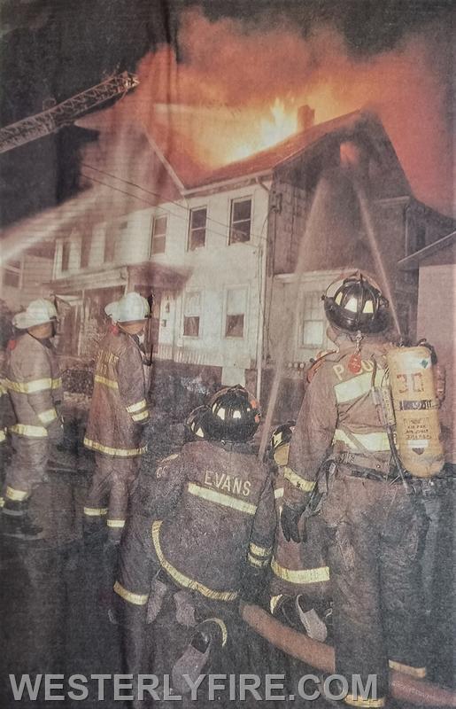 Box 4113-February 18, 1996-Westerly firefighters pour water into the house at 27 Canal St.