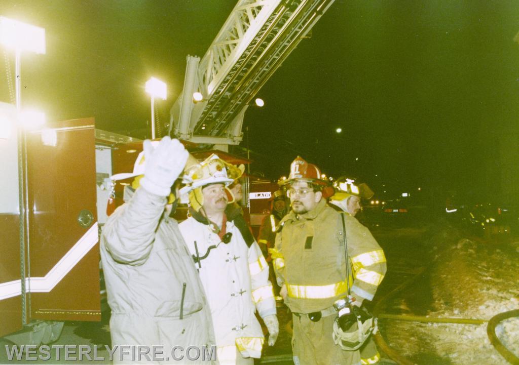 Box 4113-February 18, 1996-2nd Asst. Foreman Joe Fusaro of the Alert Hook & Ladder Co. confers with Chief Joe Misto and Asst. Chief Les King on the placement of the ladder pipe.