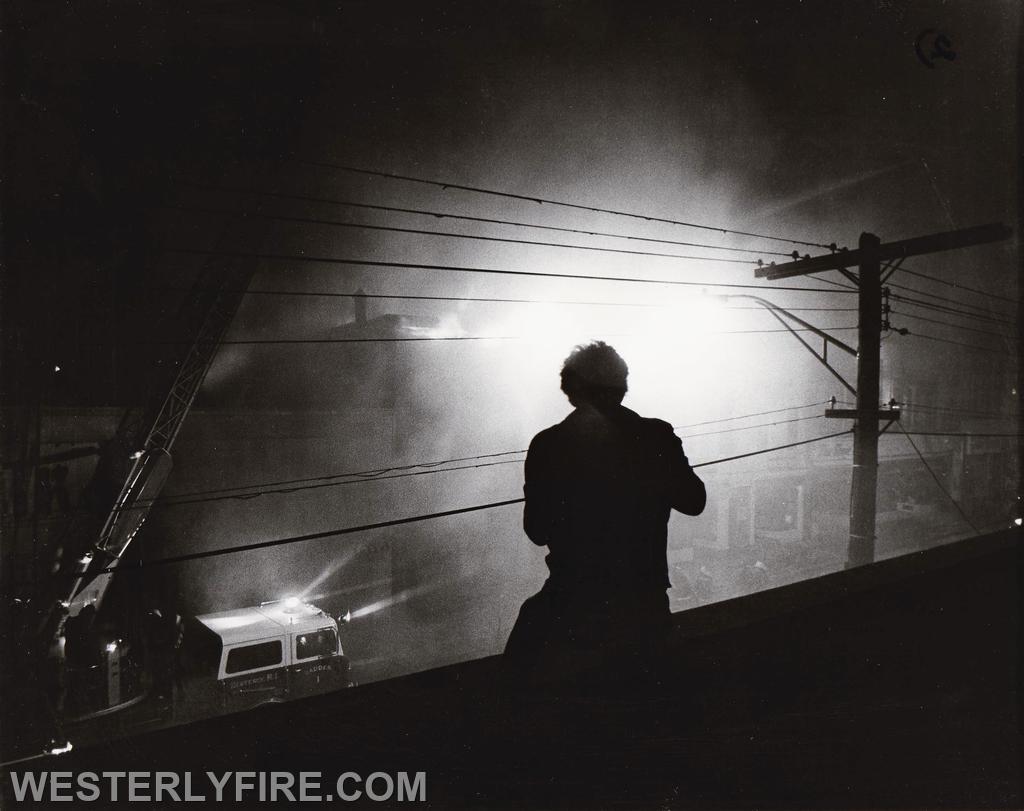Box 534-March 26, 1978-A photographer uses the roof of a building across the street. Heavy smoke obscures the front of the building.