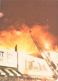 Box 534-March 26, 1978-A view from side A of the Chase fire on High St. Westerly Ladder 1's ladder pipe going to work.