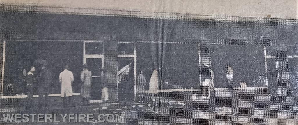Box 1125-May 22, 1960-Investigators view the damage done by the fire in the Main St. Shopping Center.